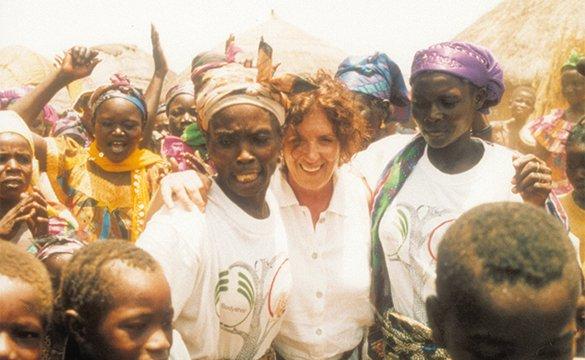 Anita Roddick in a crowd of women